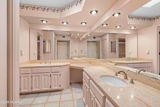 bathroom with vanity and tile patterned floors