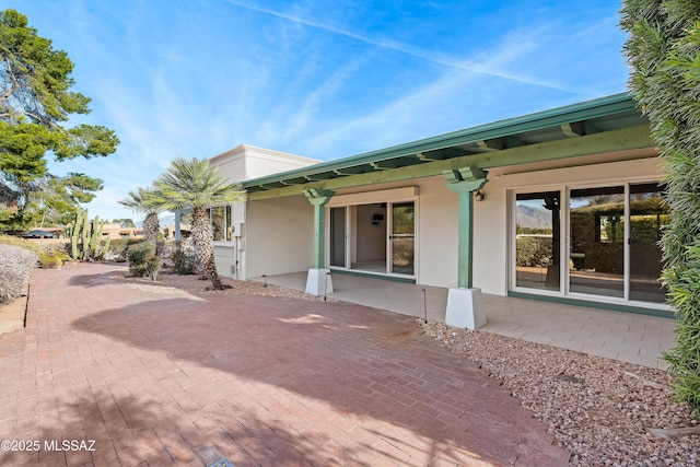 view of home's exterior with a patio