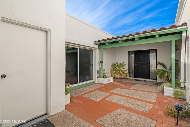 property entrance with a patio area