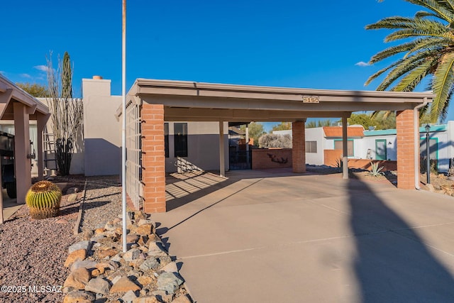 exterior space featuring a carport