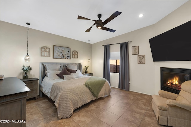 bedroom featuring ceiling fan and lofted ceiling