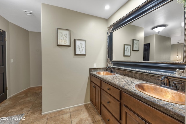 bathroom with vanity and tile patterned floors