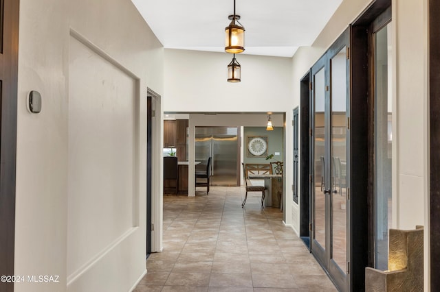 hallway featuring light tile patterned floors