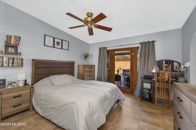 bedroom with ceiling fan, light tile patterned floors, and access to outside