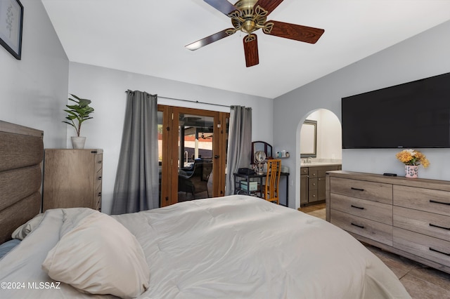 bedroom featuring ceiling fan and connected bathroom