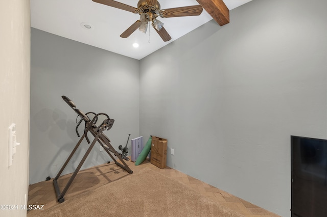 exercise room with ceiling fan and carpet flooring