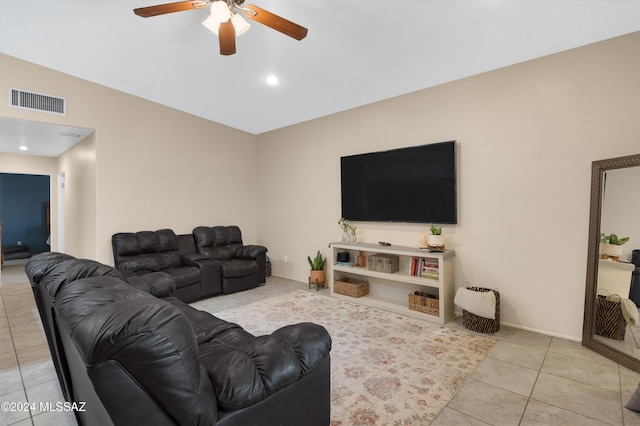 living room with ceiling fan and light tile patterned floors