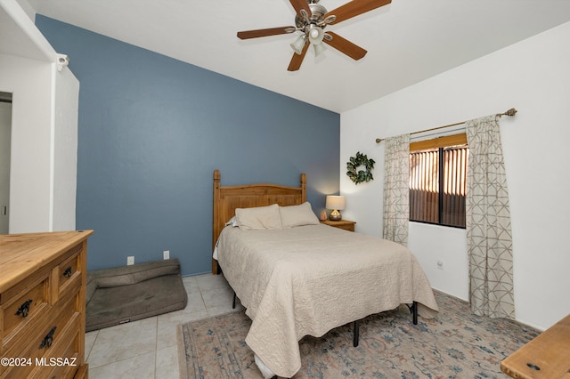 bedroom with ceiling fan and light tile patterned flooring