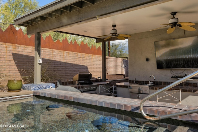 exterior space featuring ceiling fan and a grill