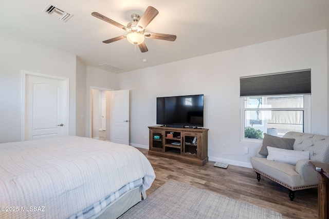 bedroom featuring ceiling fan and hardwood / wood-style floors