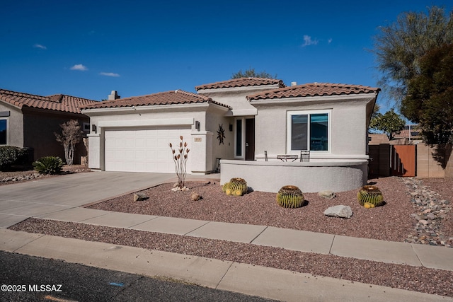 mediterranean / spanish-style house featuring a garage