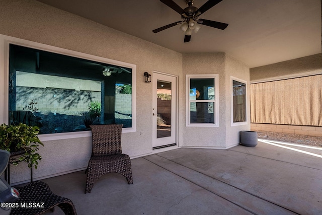 view of patio / terrace featuring ceiling fan