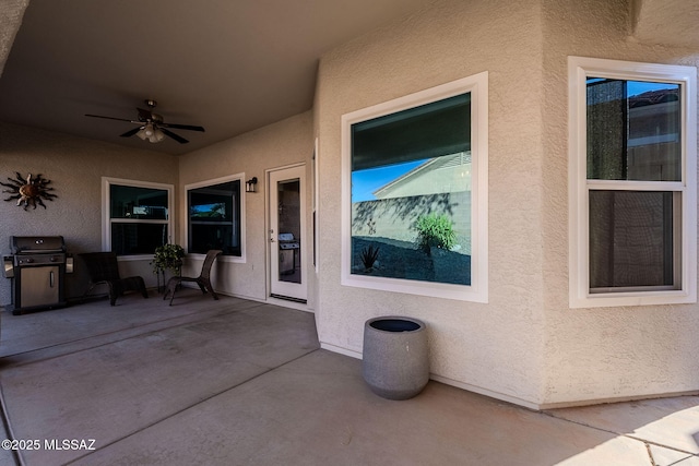 view of patio featuring ceiling fan and grilling area