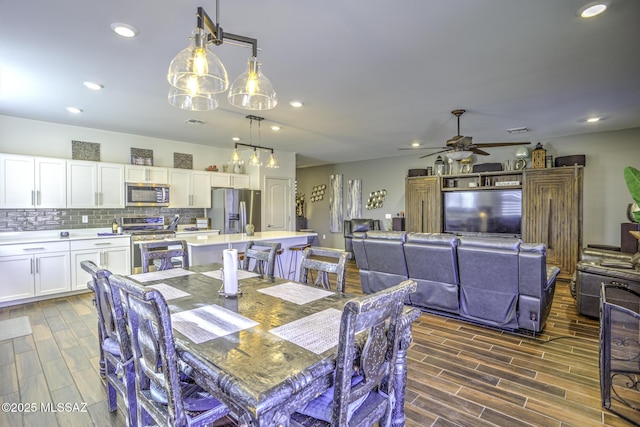 dining room featuring ceiling fan