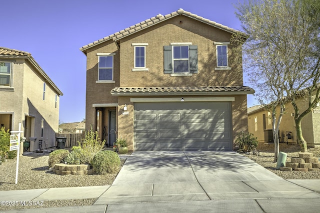 mediterranean / spanish-style home featuring a garage