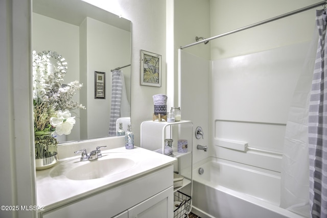 bathroom with shower / bath combo and vanity