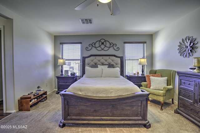 bedroom featuring ceiling fan and light carpet