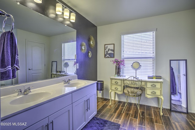 bathroom with vanity and plenty of natural light