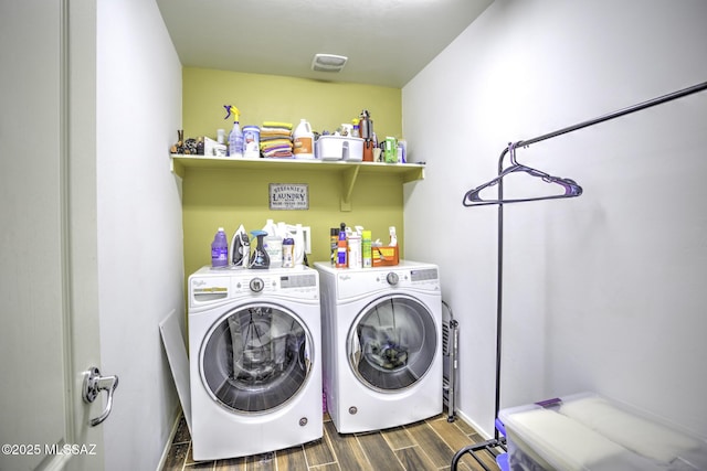 laundry room with washing machine and clothes dryer