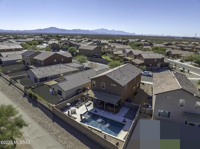 birds eye view of property with a mountain view