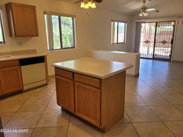 kitchen featuring a kitchen island, ceiling fan, light tile patterned flooring, and dishwasher