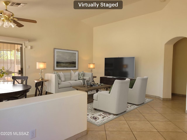 living room featuring ceiling fan and light tile patterned floors