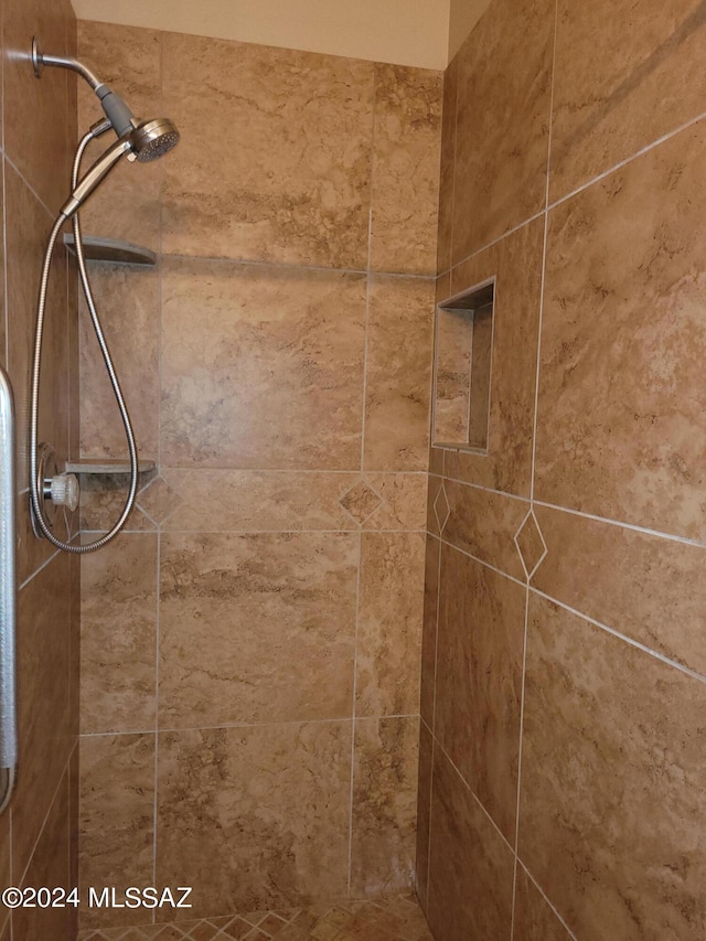 interior space with a tile shower