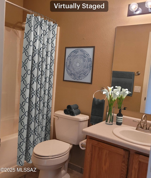 full bathroom featuring toilet, vanity, and shower / bath combo with shower curtain