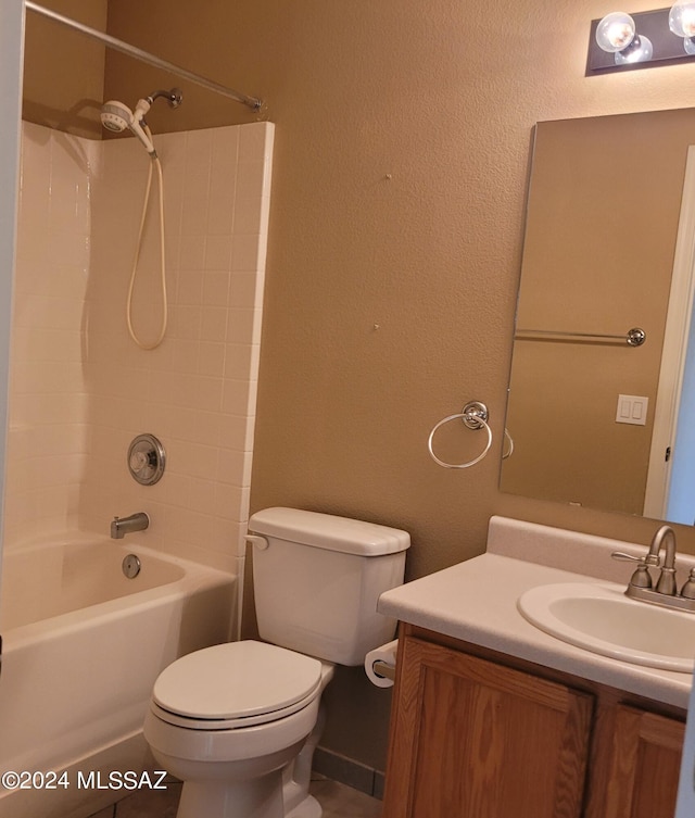 full bathroom with bathing tub / shower combination, tile patterned flooring, vanity, and toilet