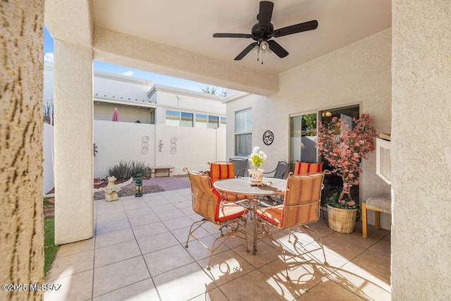 kitchen featuring a skylight, light tile patterned floors, sink, washing machine and dryer, and stainless steel appliances