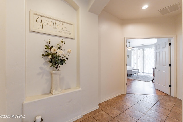 hallway featuring light tile patterned floors