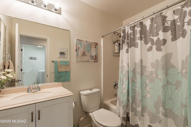 full bathroom featuring vanity, shower / tub combo, and toilet