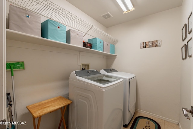 clothes washing area with independent washer and dryer