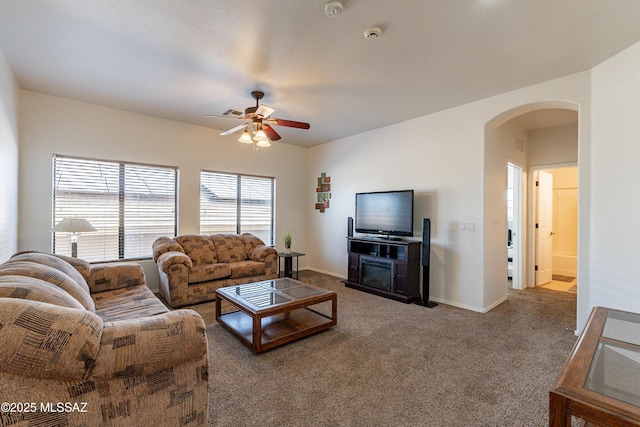 carpeted living room featuring ceiling fan