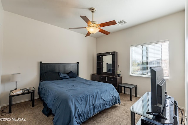 bedroom featuring light colored carpet and ceiling fan