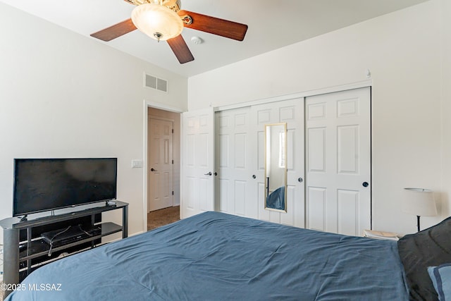 bedroom featuring ceiling fan and a closet