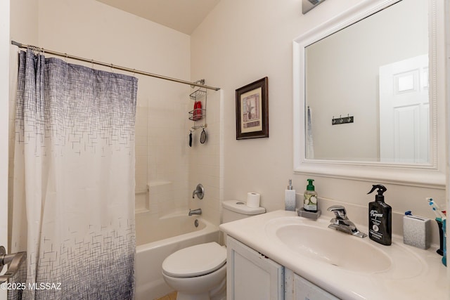 full bathroom with shower / tub combo with curtain, vanity, and toilet