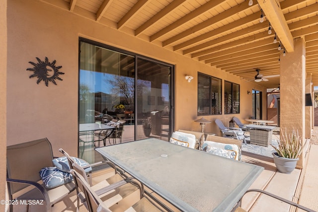 view of patio / terrace featuring ceiling fan