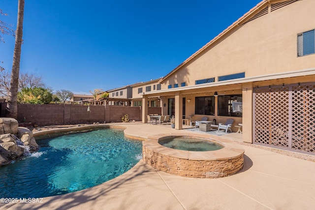 view of pool with an outdoor living space, a patio, and an in ground hot tub