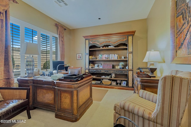 office with visible vents and light colored carpet