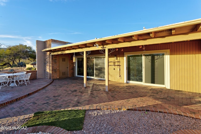 rear view of house featuring a patio