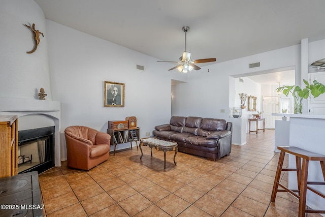 living room featuring ceiling fan and light tile patterned floors