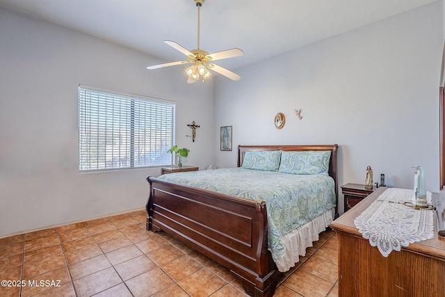 tiled bedroom with ceiling fan