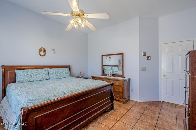 tiled bedroom featuring ceiling fan