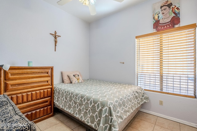 tiled bedroom featuring ceiling fan