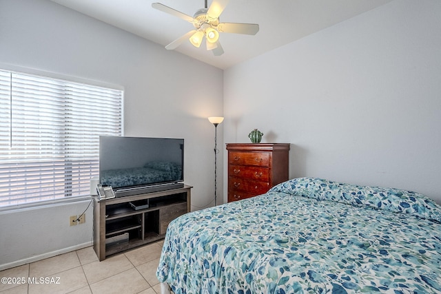 tiled bedroom featuring ceiling fan and vaulted ceiling