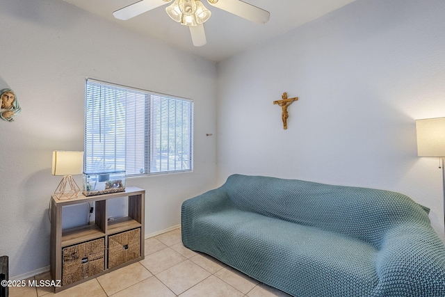 sitting room featuring ceiling fan and light tile patterned floors