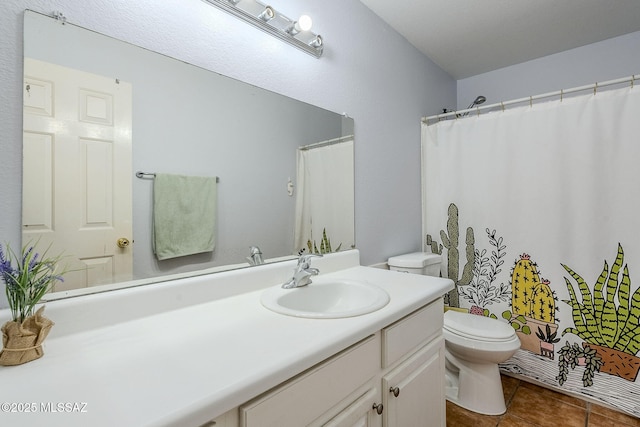 bathroom with toilet, tile patterned flooring, and vanity