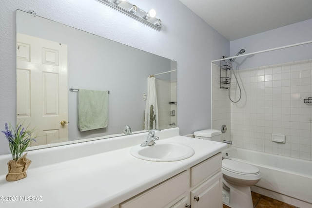 full bathroom with tile patterned flooring, shower / tub combo with curtain, vanity, and toilet