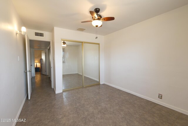 bathroom featuring walk in shower, tile patterned flooring, vanity, and toilet